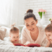 Signs of Bed Bugs and How to Get Rid of Them - woman and 2 young girls laying on bed and reading